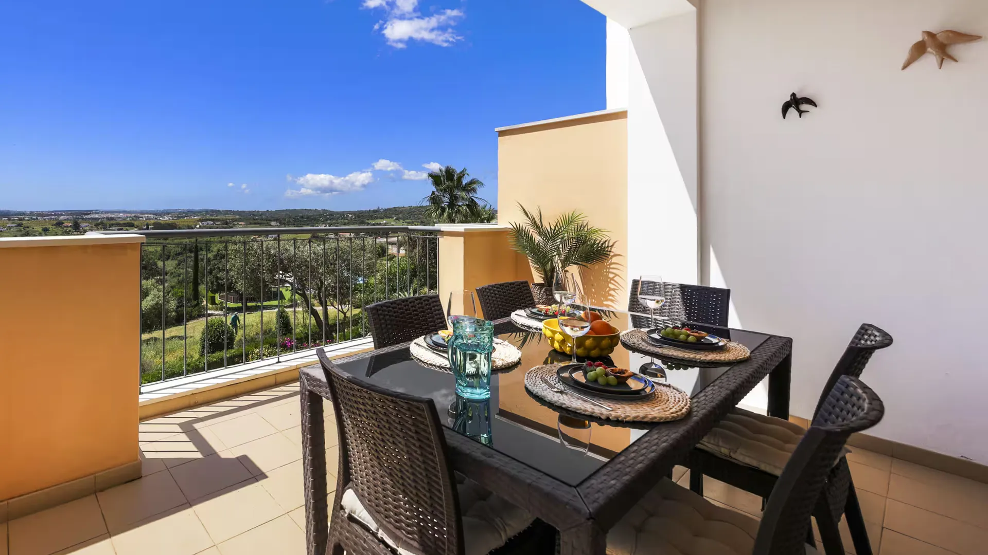 Villa Calma terrace at golden hour overlooking the Algarve hills