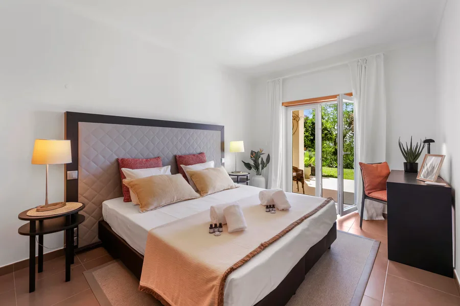Elegant bedroom overlooking villa grounds
