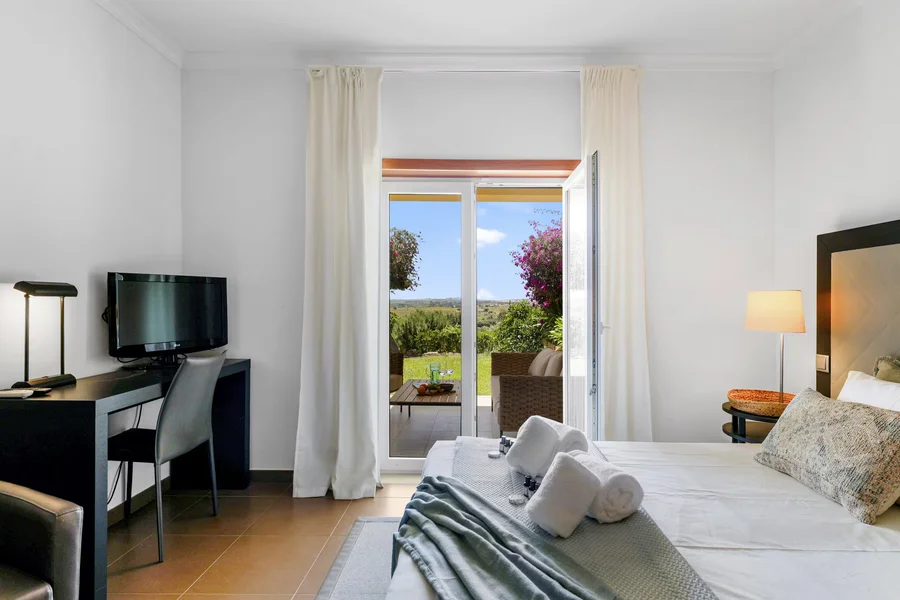 Airy bedroom with sunset views