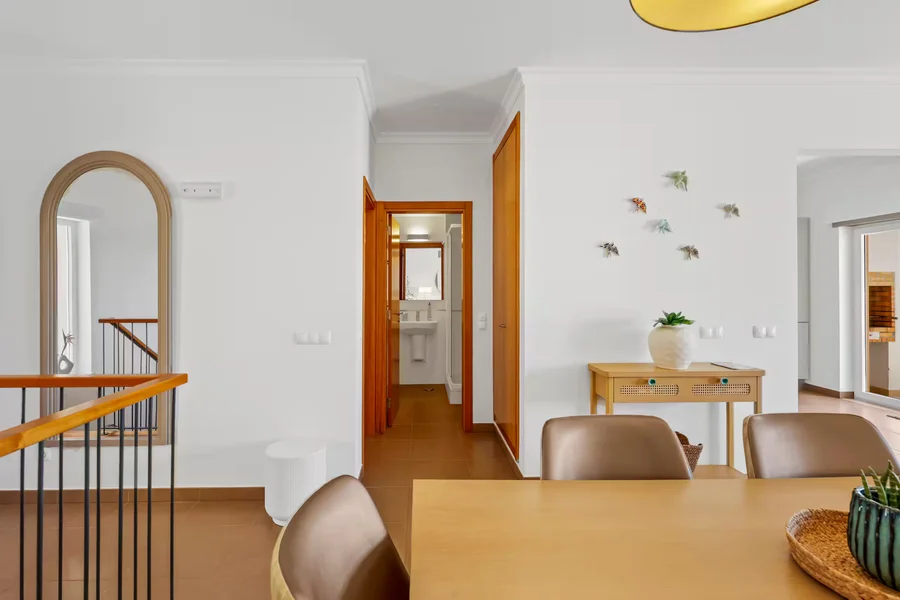 Elegant dining area with hallway view