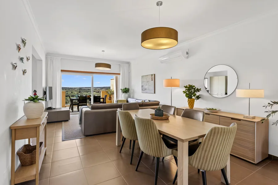 Open-plan dining area overlooking living room