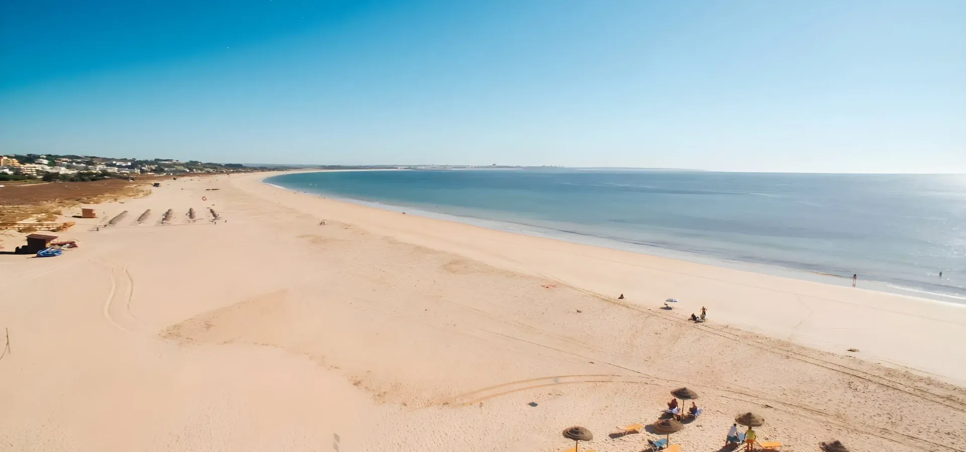 Aerial view of Meia Praia beach at golden hour