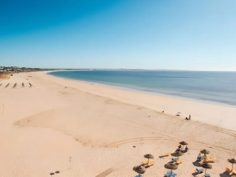 Aerial view of Meia Praia beach at golden hour