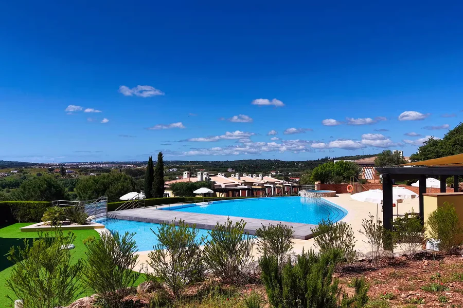 Crystal-clear pool water with surrounding deck