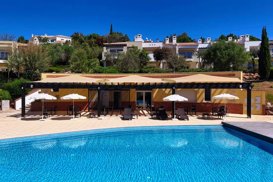 Pool area with shade structures and seating